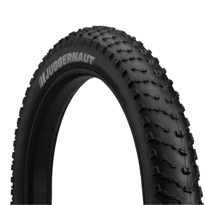 Black off-road tire with 'Juggernaut' branding on a white background